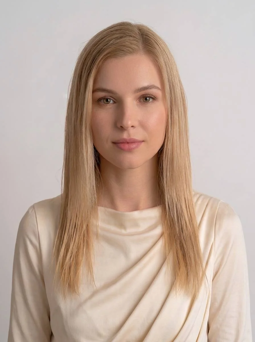 Portrait of the model with long, brushed, lightly damp blonde hair before styling